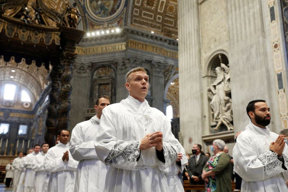 Seminarians from the Pontifical North American College walk in procession during the ordination of new deacons in St. Peter's Basilica at the Vatican in September. (CNS/Paul Haring)