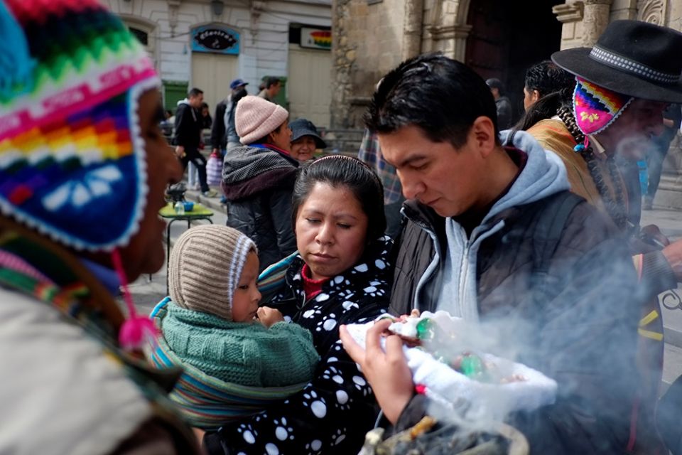 A family carries figurines of the Christ Child outside St. Francis Church during celebrations for the feast of the Epiphany, Jan. 6, 2019, in La Paz, Bolivia. (CNS/Reuters/David Mercado)