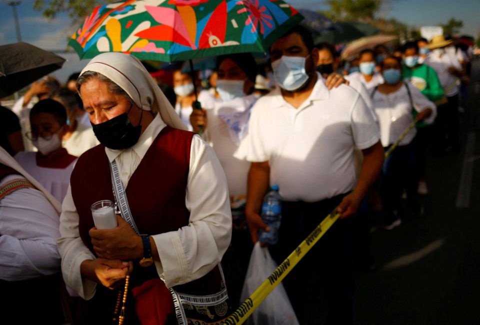 A nun joins people with missing relatives and victims of violence during a procession in Ciudad Juarez, Mexico July 28, 2022, in memory of their loved ones as part of the Praying Days for Peace called by the Catholic Church 