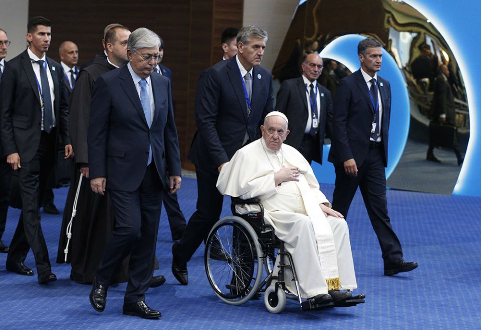 Pope Francis and Kazakh President Kassym-Jomart Tokayev, left, arrive for the conclusion of the Congress of Leaders of World and Traditional Religions at the Palace of Peace and Reconciliation Sept. 15 in Nur-Sultan, Kazakhstan. (CNS/Paul Haring)