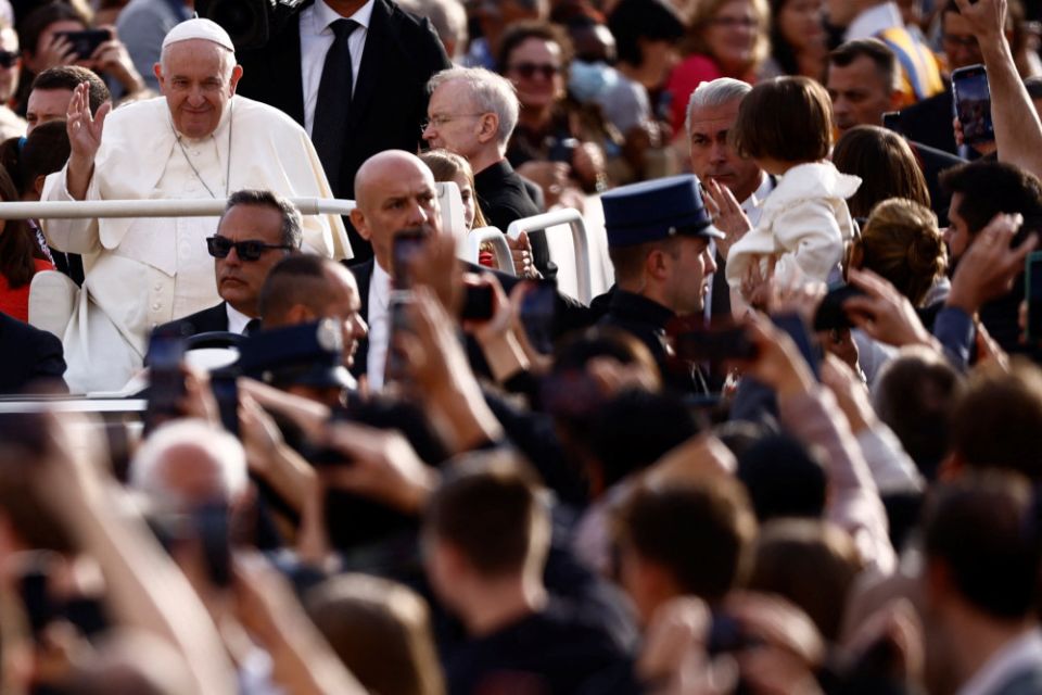 Pope Francis greets people during his general audience in St. Peter's Square at the Vatican Sept. 28, 2022. (CNS photo/Yara Nardi, Reuters)