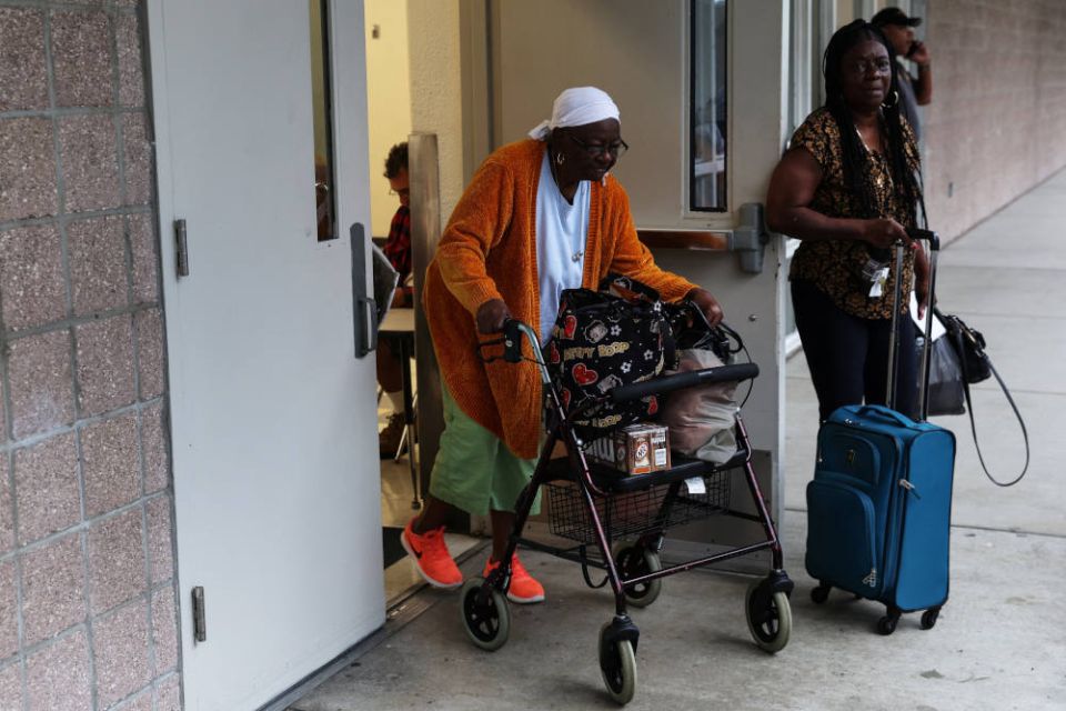 People at Lockhart Elementary School in Tampa, Fla., leave the shelter for evacuees ahead of Hurricane Ian Sept. 28, 2022. (CNS photo/Shannon Stapleton, Reuters)