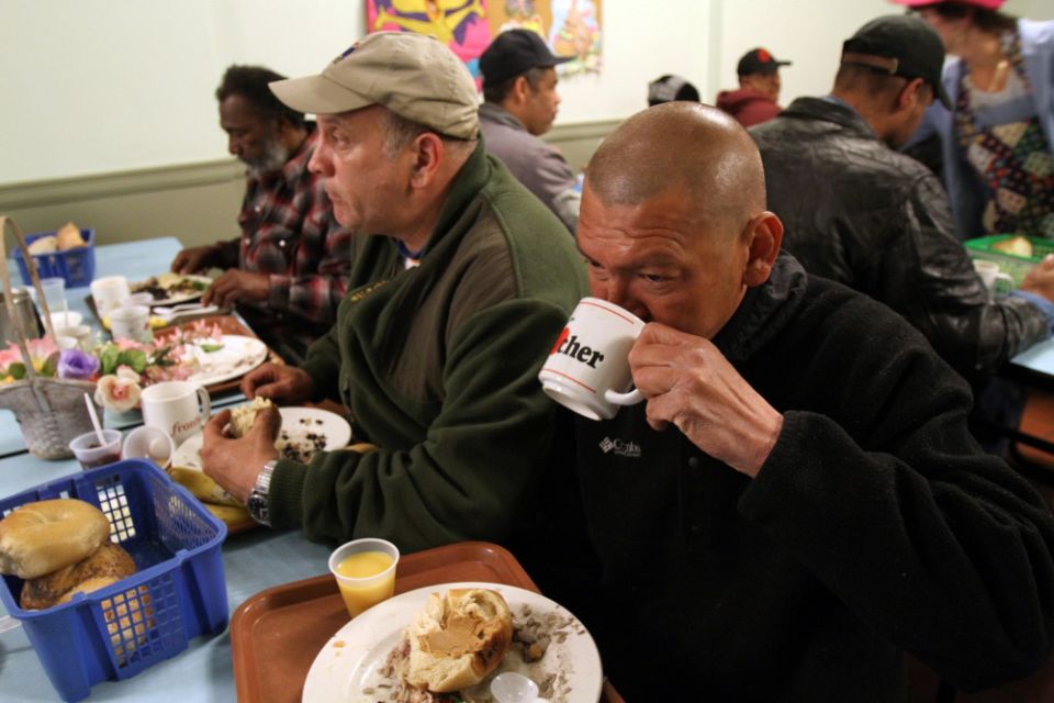 Men are pictured in a file photo eating a free meal in the cafeteria of a Franciscan-run soup kitchen in the Park Slope section of Brooklyn, N.Y. The U.N.'s celebration of World Food Day is Oct. 16