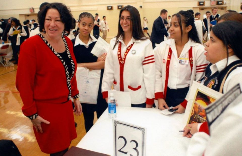 Sonia Sotomayor, then a federal appeals court judge, chats with students at her alma mater, Cardinal Spellman High School in the Bronx section of New York, in this undated photo released by the White House in 2009. (CNS/Reuters/White House handout)
