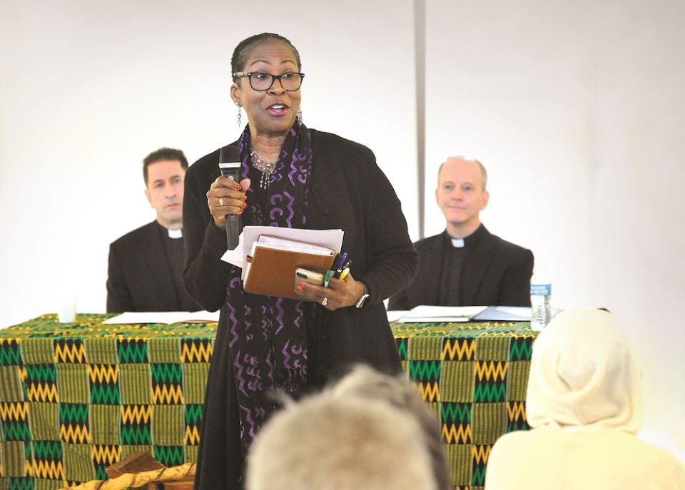 Cheryllyn Branche, vice president of the GU272 Descendants Association, speaks at a listening session Dec. 9, 2017, for descendants of 272 enslaved persons sold to a Louisiana plantation owner by the Jesuits of Georgetown University in 1838. At left is Je