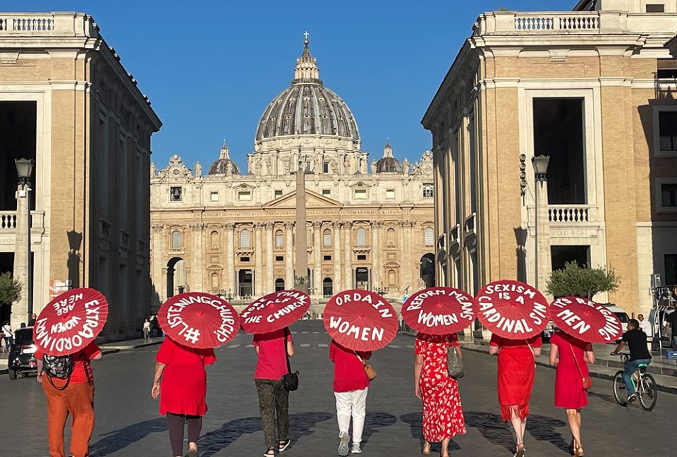 Women's ordination advocates walk towards St. Peter's Square as part of a witness on Aug. 29. (NCR photo/Christopher White) Women's ordination advocates walk towards St. Peter's Square as part of a witness on Aug. 29. (NCR photo/Christopher White)
