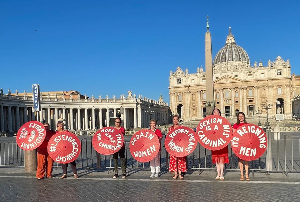 Women's ordination advocates pose outside St. Peter's Square as part of a witness on Aug. 29. (NCR photo/Christopher White) Women's ordination advocates pose outside St. Peter's Square as part of a witness on Aug. 29. (NCR photo/Christopher White)