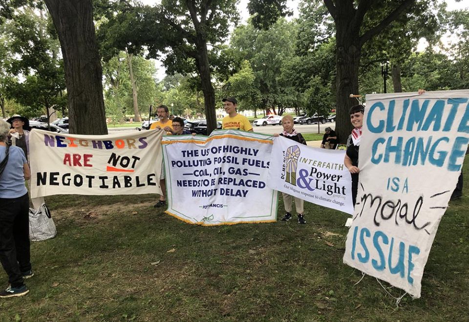 Representatives of faith groups hold banners for a group picture at the "No Sacrifice Zones: Appalachian Resistance Comes to D.C." rally on Sept. 8 in Washington, D.C. (EarthBeat photo/Aleja Hertzler-McCain)