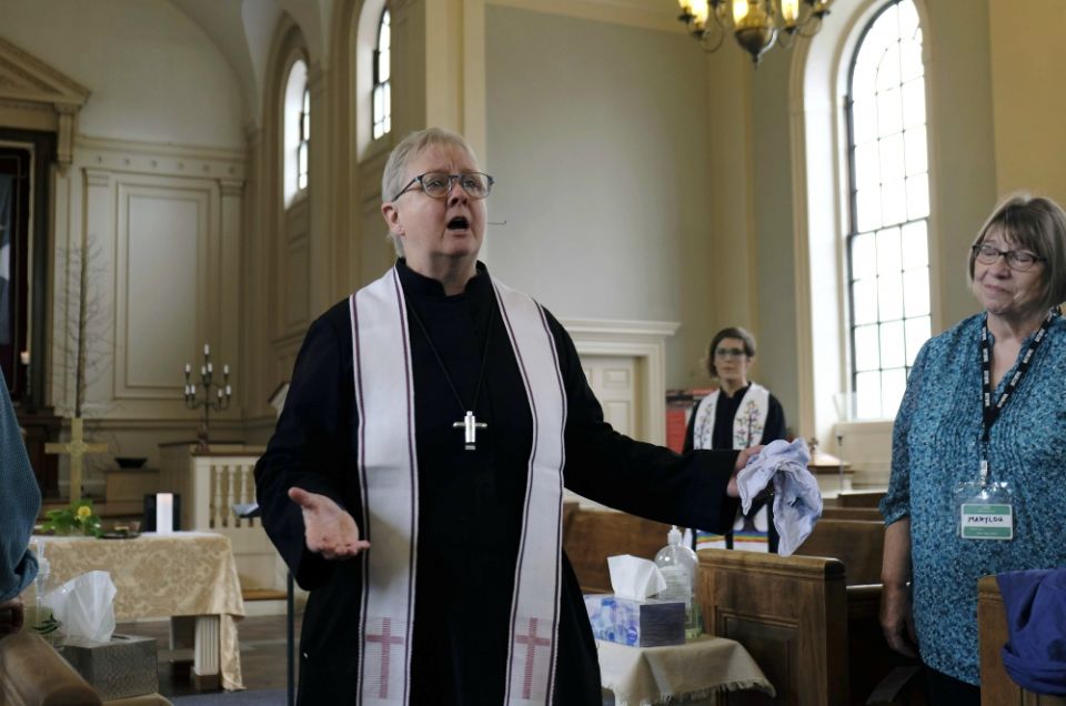 The Rev. Laura Ruth Jarrett leads worship at Boston's Hope Central Church June 2. (RNS/Aysha Khan)