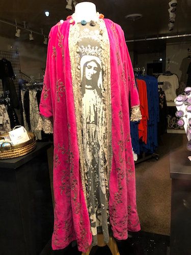 A Virgin Mary inspired dress stands on display in the front window of a shop in Rehoboth, Delaware in March 2021. RNS photo