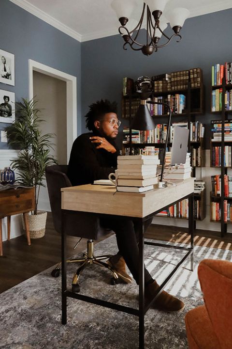 Danté Stewart works in his office. (RNS/CrownedGold Photography/Taja Ambrose)