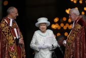Britain's Queen Elizabeth II smiles as she leaves St. Paul's Cathedral in London with the Revs. David Ison and Michael Colclough following a thanksgiving service to mark her diamond jubilee in London June 5, 2012. (CNS/Reuters/Andrew Winning)