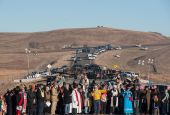 Clergy of many faiths from across the United States participate in a prayer circle Nov. 3, 2016, in front of a bridge in Standing Rock, North Dakota, where demonstrators confront police during a protest of the Dakota Access pipeline. (CNS/Reuters/Stephani