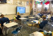 Teacher Melissa Pinkney instructs students during a Spanish class at Thomas More Prep-Marian Jr./Sr. High School in Hays, Kansas, Dec. 3, 2020. The school was in a hybrid model, with half of the students in class and the other half connecting virtually.