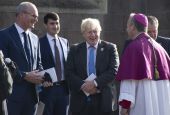 Archbishop Eamon Martin of Armagh, Northern Ireland, speaks with Irish Foreign Affairs Minister Simon Coveney, far left, and British Prime Minister Boris Johnson following a service to mark the centenary of the partition of Ireland in Armagh Oct. 21, 2021