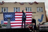 Democratic presidential nominee Joe Biden raises his arm during a drive-in campaign event in Toledo, Ohio, Oct. 12. (CNS//Reuters/Rebecca Cook)