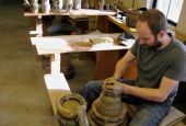 Apprentice Brandon Russell works at the potter's wheel in the St. John's Pottery studio in Collegeville, Minnesota. (Zoe Ryan)