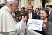 Pope Francis greets Swedish climate activist Greta Thunberg during his general audience in St. Peter's Square at the Vatican April 17, 2019. (CNS photo/Yara Nardi, Reuters)