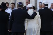Argentine Rabbi Abraham Skorka embraces Pope Francis as they leave after praying at Jerusalem's Western Wall Jerusalem in 2014. On the right is Omar Abboud, a Muslim leader from Argentina. (CNS/Paul Haring)