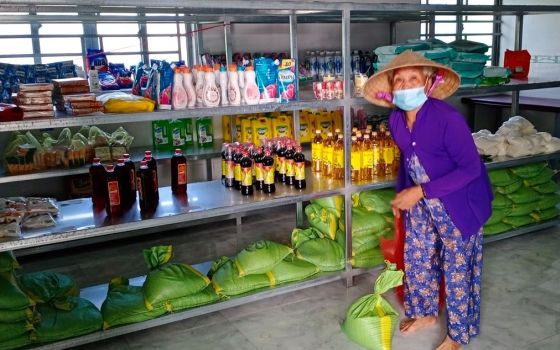 Father Joseph, the priest at Duong Lang parish, organizes a free supermarket that provides salt, sugar, soy sauce, instant noodles and rice for the people living in poverty. (Mary Nguyen Thi Phuong Lan)