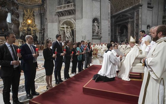 Pope Francis gives his blessing to a group of people after celebrating Mass in St. Peter's Basilica Oct. 11 to mark the 60th anniversary of the opening of the Second Vatican Council. (CNS/Vatican Media)