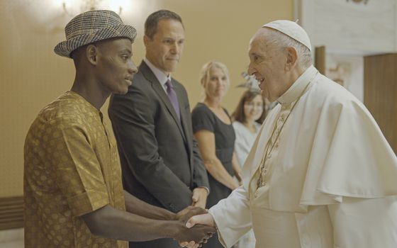 Pope Francis meets with Arouna Kandé, a climate refugee from Senegal, in a scene from "The Letter: A Message for Our Earth," a new documentary based upon the pope's 2015 ecology encyclical "Laudato Si', on Care for Our Common Home." (Laudato Si' Movement)